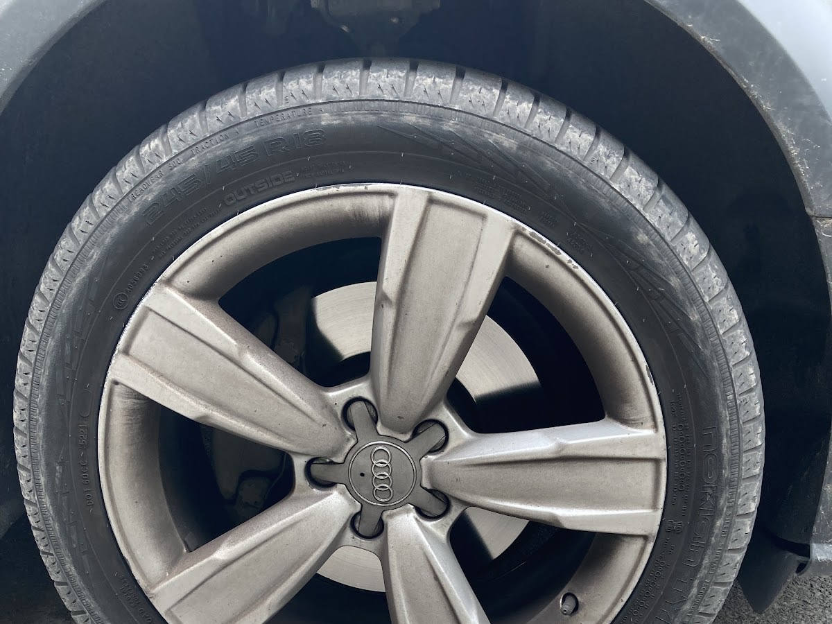 Close-up of an Audi alloy wheel and tire.
